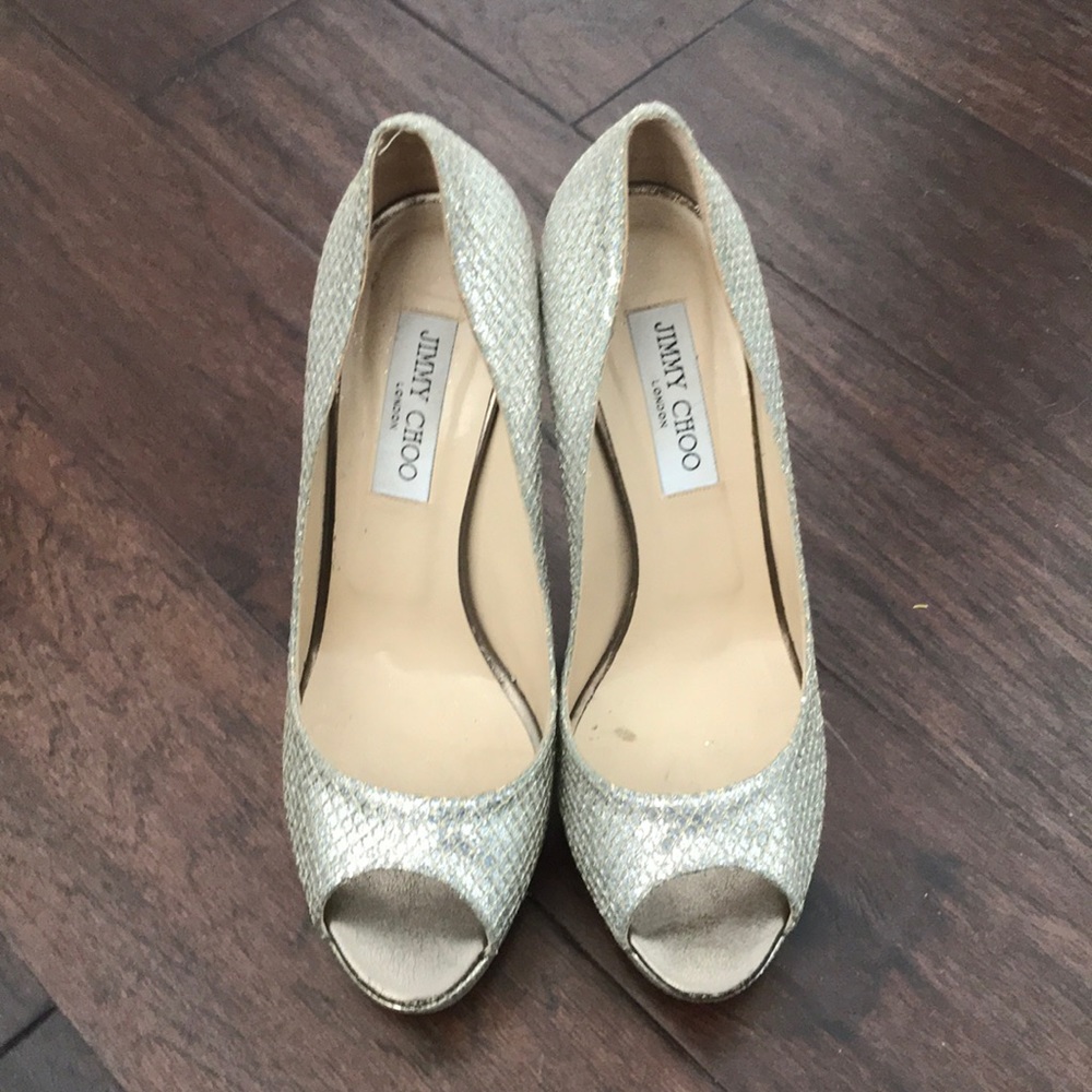 Silver Jimmy Choo peep-toe heels. Used